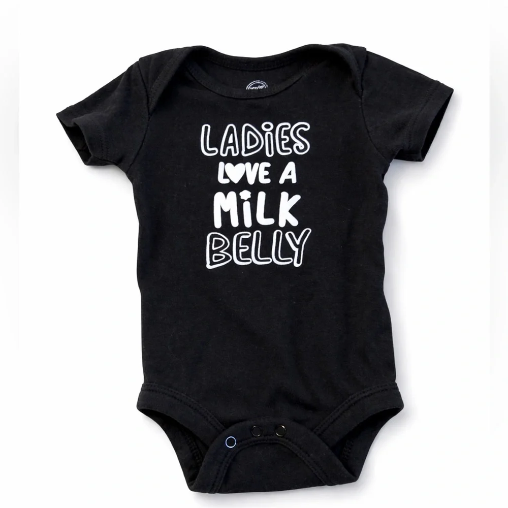 wonder nation Black Baby Bodysuit with White Text “ladies love a milk belly” - Picture 1 of 4